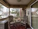 Relaxing porch with rocking chairs, offering a view of the neighborhood at 5101 Hogans Way, Clayton, NC 27520