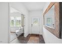 Bright and airy entryway with wood-look floors and a large mirror at 180 Paper Birch Way, Fuquay Varina, NC 27526