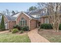 Brick front of charming townhome with landscaped walkway at 3347 Ridgecrest Ct, Raleigh, NC 27607