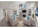 Bright living room features a fireplace, large windows, and soaring ceilings at 4703 Paces Ferry Dr, Durham, NC 27712
