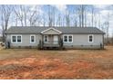 Gray single story home with a covered porch and landscaping at 5724 Walters Ln, Burlington, NC 27217