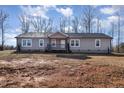 Ranch style home with gray siding and a landscaped yard at 5724 Walters Ln, Burlington, NC 27217