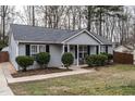 Well-maintained home with a landscaped front yard and classic architectural details at 121 Holly Mountain Rd, Holly Springs, NC 27540