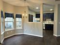 Bright dining area with a view to the kitchen at 1211 Canyon Rock Ct # 111, Raleigh, NC 27610