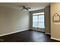 Spacious living room with dark hardwood floors and ceiling fan at 1211 Canyon Rock Ct # 111, Raleigh, NC 27610