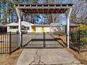 Home with pergola entryway and gated driveway at 1306 Hudson Ave, Durham, NC 27705