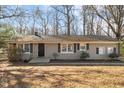 House exterior featuring a neutral color palette and well-maintained landscaping at 1508 Carroll Heights Rd, Zebulon, NC 27597