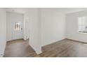 Bright and airy entryway with white door and wood-look flooring at 192 Paper Birch Way, Fuquay Varina, NC 27526