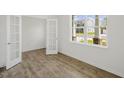 Home office with wood-look floors and french doors at 192 Paper Birch Way, Fuquay Varina, NC 27526