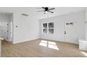 Bright living room with hardwood floors and access to kitchen at 203 Royal St, Fuquay Varina, NC 27526