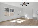 Light-filled living area featuring hardwood floors and built-in bench at 203 Royal St, Fuquay Varina, NC 27526