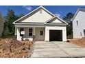 Charming single-story home with a concrete driveway and light beige siding at 356 Maidenhair Pl, Clayton, NC 27520