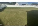 Large, flat backyard with a white fence, perfect for outdoor activities and entertaining at 359 Ballast Pt, Clayton, NC 27520