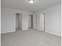Spacious bedroom with neutral carpet and multiple doorways at 3860 Well Fleet Drive, Fuquay Varina, NC 27526