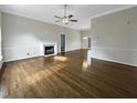 Spacious living room with hardwood floors and a fireplace at 4109 Mangrove Dr, Raleigh, NC 27616