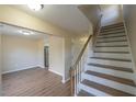 View of staircase and hardwood floors leading to upper level at 412 N Cooper St, Clayton, NC 27520