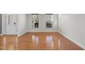 Bright living room featuring hardwood floors and large windows at 424 Waverly Hills Dr, Cary, NC 27519