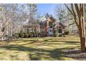 Brick house with a large yard and mature trees at 5120 Tallwood Dr, Raleigh, NC 27613