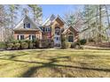 Two-story home with a brick facade and landscaped yard at 5120 Tallwood Dr, Raleigh, NC 27613