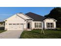 Beautiful traditional house with a two-car garage, a white siding, and well-manicured lawn and landscaping at 565 Sweet Potato Lane # 07, Nashville, NC 27856