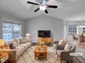 Virtually staged living room featuring a neutral color palette and modern furniture at 610 Lockwood Dr, Clayton, NC 27527