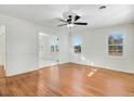 Bright living room featuring hardwood floors and a ceiling fan at 8179 Highway 39, Middlesex, NC 27557