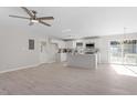 Modern kitchen with white cabinets, island, and stainless steel appliances at 141 Eason Dr, Smithfield, NC 27577