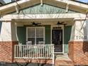 Inviting front porch with rocking chairs and ceiling fans at 2260 Dunlin Ln, Raleigh, NC 27614