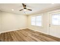 Bright living room with hardwood floors and ceiling fan at 2400 Dorety Pl, Raleigh, NC 27604