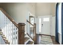 Bright entryway with hardwood floors, staircase, and a view to the living area at 3142 Armeria Dr, Apex, NC 27502