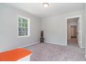 Bright bedroom with neutral walls and carpet at 423 Potter St, Durham, NC 27701