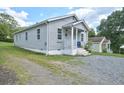 Gray house with front porch and gravel driveway at 425 Potter St, Durham, NC 27701