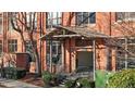 Brick building exterior with covered entryway and stairs at 500 N Duke St # 56-207, Durham, NC 27701