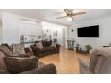 Cozy living room with hardwood floors, comfortable seating and a view of the dining area at 5141 Nc-39 N Hwy, Henderson, NC 27537