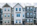 Charming multi-story townhomes featuring varied colors, stone accents, and inviting entryways at 5238 Beardall St, Raleigh, NC 27616