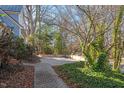 Brick pathway leads to a patio area with lush greenery at 806 E Franklin St, Chapel Hill, NC 27514