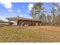 Large backyard with mature trees surrounding the home at 1113 W Mount Dr, Rocky Mount, NC 27803