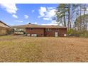 Large backyard with mature trees surrounding the home at 1113 W Mount Dr, Rocky Mount, NC 27803