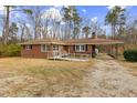 Brick ranch house with ramp access and a spacious yard at 1113 W Mount Dr, Rocky Mount, NC 27803