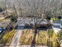Ranch house with large backyard and surrounding trees at 1205 Glen Eden Dr, Raleigh, NC 27612