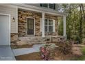 Front porch with stonework and landscaping at 2048 Long Point Trl, Sanford, NC 27332