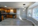 Kitchen with wood cabinets and stainless steel appliances at 248 Southgate Dr, Garner, NC 27529