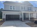 Charming two-story home with a two car garage and inviting front porch at 250 Tidal Pool Way, Cary, NC 27519