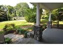 Inviting front porch with stone pillars and a view of the yard at 326 Webster St, Cary, NC 27511
