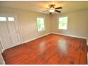 Bright living room featuring hardwood floors and a ceiling fan at 326 Webster St, Cary, NC 27511