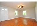 Bright living room featuring hardwood floors and a ceiling fan at 326 Webster St, Cary, NC 27511