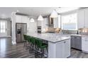 Modern kitchen with white cabinets, granite countertops, and stainless steel appliances at 334 Arcadius Dr, Clayton, NC 27520