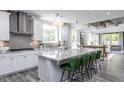 Modern kitchen with white cabinets, granite countertops, and stainless steel appliances at 334 Arcadius Dr, Clayton, NC 27520