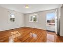Bright living room featuring hardwood floors and bay window at 3817 Booker Ave, Durham, NC 27713