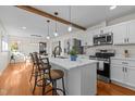 Modern kitchen featuring a large island, stainless steel appliances, and hardwood floors at 420 Nelson St, Durham, NC 27707